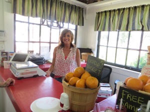 3 generations have farmed this land, and here is the lovely wife tending the Fruit stand today!