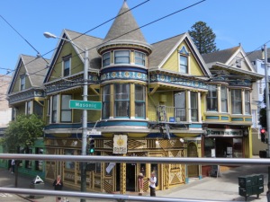 This type of building structure is called a "Painted Lady"...when it has 3 different colors on the structure. They are all protected as Historic Buildings, and must be preserved. They only may change the color of the paint...nothing else.